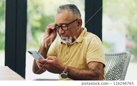 Glasses, phone and mature man reading news, email or crossword puzzle on internet in home. Smartphone, retirement and blurry vision of person with poor eyesight, glaucoma or squinting on mobile app Glasses, phone and mature man reading news, email or crossword puzzle on internet in home. Smartphone, retirement and blurry vision of person with poor eyesight, glaucoma or squinting on mobile app 116296765