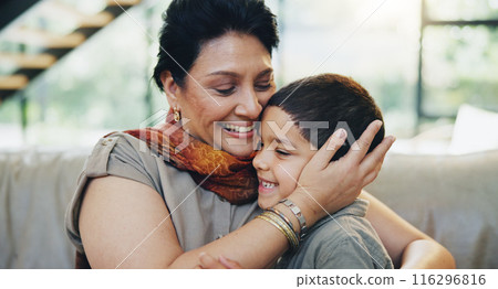 Smile, child and hug grandmother on sofa at house for bonding, love and relax with care on weekend break. Happy, mature woman and boy gratitude embrace, family support and security together in lounge 116296816