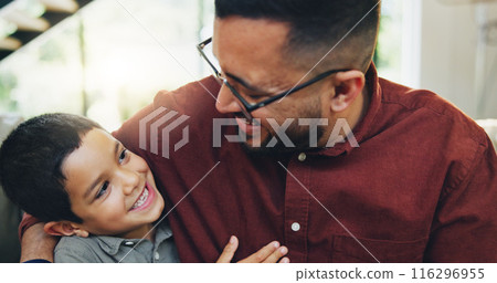 Smile, hug and child with dad on sofa in home relaxing together for fathers day celebration. Happy, love and boy kid embracing with man for care, bonding and family time in living room at house. 116296955
