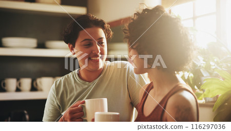 Women, couple and lesbian in kitchen with coffee on morning for breakfast, relax and enjoy. Support, care and happy or conversation with cup of tea to chill, fun and bonding for relationship and home Women, couple and lesbian in kitchen with coffee on morning for breakfast, relax and enjoy. Support, care and happy or conversation with cup of tea to chill, fun and bonding for relationship and home 116297036