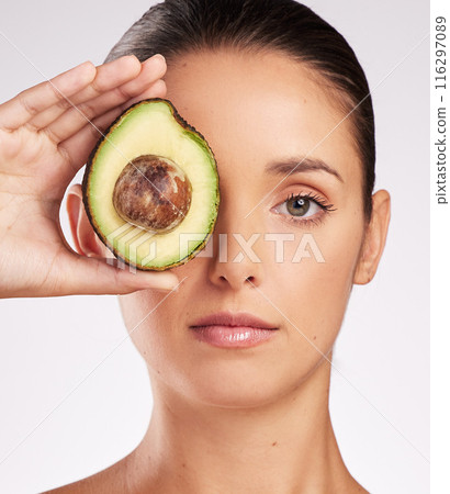 Avocado, hand of woman and skincare with portrait in studio for anti aging, moisturize or glowing skin on white background. Wellness, fruit and model for vitamin C, dermatology or organic cosmetics Avocado, hand of woman and skincare with portrait in studio for anti aging, moisturize or glowing skin on white background. Wellness, fruit and model for vitamin C, dermatology or organic cosmetics 116297089