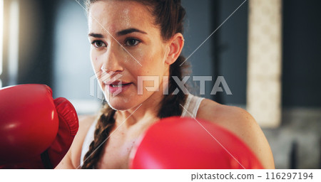 Woman, fitness and boxing in gym for training, self defense and exercise for development. Power workout, gloves and female athlete with equipment for sport, sweating and fighting with hard work 116297194