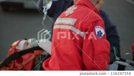 People, paramedic and help patient in outdoor on scene for emergency, rescue and support. Emt team, healthcare and oral oxygen for injured person on accident for medical service, care and first aid 116297358