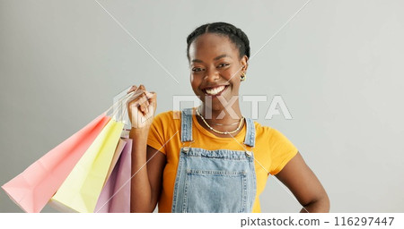 African woman, shopping bag and sale in studio portrait with smile for fashion choice by white background. Girl, product and customer experience with package, deal and discount with financial freedom African woman, shopping bag and sale in studio portrait with smile for fashion choice by white background. Girl, product and customer experience with package, deal and discount with financial freedom 116297447