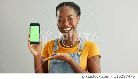 Woman, smartphone and green screen or happy in studio, student and online course with mobile application on web. Tech, connection and communication or education ads, info and scholarship announcement 116297470