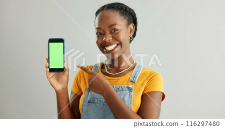 Woman, smartphone and green screen or smile in studio, student and online course with mobile application on web. Tech, connection and communication or education ads, info and scholarship announcement 116297480