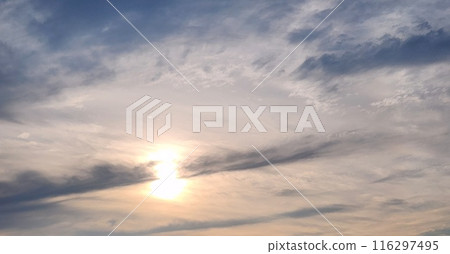 The sun seen through the gaps in the clouds 116297495