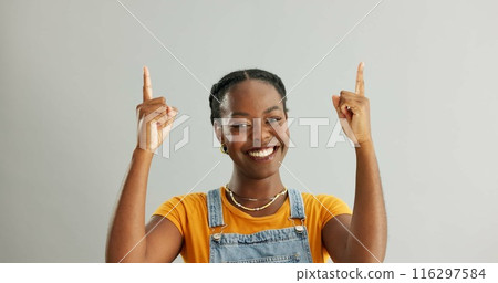 Portrait, pointing and black woman in studio for college registration, notification or information on gray background. Mockup, smile and person with hand gesture for opportunity, advice or decision 116297584