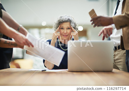 Confused, chaos and business woman in office with documents, report and admin crisis on computer. Mature manager or CEO headache or thinking of solution for multitasking and staff time management 116297714