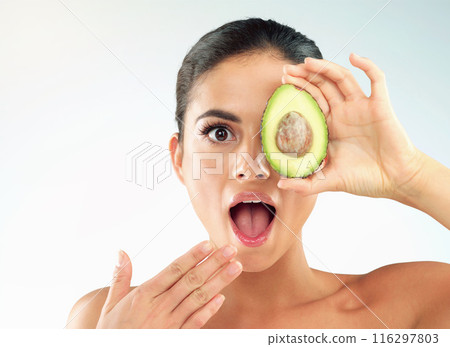 Woman, portrait and avocado for skincare in studio with wow, surprised and shocked for beauty benefits. Model, girl and mockup with fruit for natural cosmetics and antioxidants on white background Woman, portrait and avocado for skincare in studio with wow, surprised and shocked for beauty benefits. Model, girl and mockup with fruit for natural cosmetics and antioxidants on white background 116297803