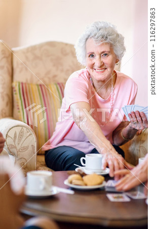 Portrait, senior woman and poker with friends playing cards in retirement home together. Assisted living, competition or game with happy elderly people in apartment for bonding, fun or leisure Portrait, senior woman and poker with friends playing cards in retirement home together. Assisted living, competition or game with happy elderly people in apartment for bonding, fun or leisure 116297863