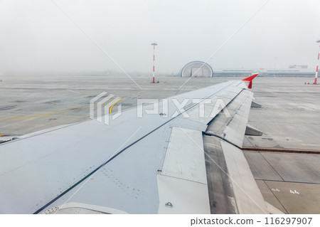View from the airplane window during taking off on a clear summer morning. Yekaterinburg, Russia 116297907