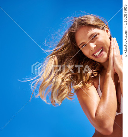 Woman, portrait and bikini on blue sky for summer, vacation and beach smile or outdoor wind mockup. Tourist, nature and Miami for confidence, clean air and weekend travel with swimsuit for low angle 116297909