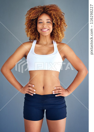 Confident, fitness and portrait of woman in studio for exercise, training and workout on gray background. Sports, athlete and person with happy, pride and smile for wellness, healthy body and gym Confident, fitness and portrait of woman in studio for exercise, training and workout on gray background. Sports, athlete and person with happy, pride and smile for wellness, healthy body and gym 116298227