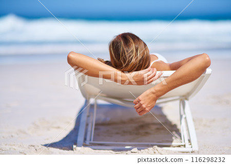 Back view, relax and woman on chair at beach for adventure, holiday or sunshine at tropical resort in Maldives. Female person, island and travel on vacation, peace or blue sky for sunbathing Back view, relax and woman on chair at beach for adventure, holiday or sunshine at tropical resort in Maldives. Female person, island and travel on vacation, peace or blue sky for sunbathing 116298232