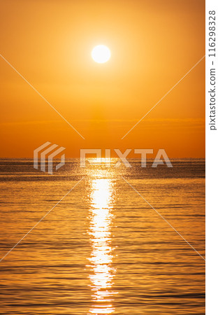 Beautiful red and orange sunrise over the sea. Beautiful red and orange sunrise over the sea. 116298328