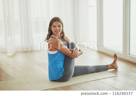 Yoga, mat and woman stretching leg in home relax with smile for health, wellness and practice on weekend. Peaceful, female person and body exercise on floor in home for pilates, self care and warm up Yoga, mat and woman stretching leg in home relax with smile for health, wellness and practice on weekend. Peaceful, female person and body exercise on floor in home for pilates, self care and warm up 116298337