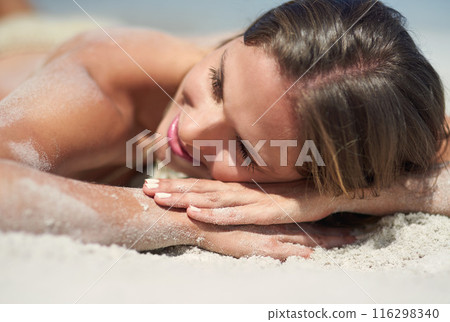 Relax, lying and girl on beach for tanning, sunbathing and outdoor on seaside with calm. Ocean, sand and female person in California for vacation, weekend holiday and adventure for summer break Relax, lying and girl on beach for tanning, sunbathing and outdoor on seaside with calm. Ocean, sand and female person in California for vacation, weekend holiday and adventure for summer break 116298340