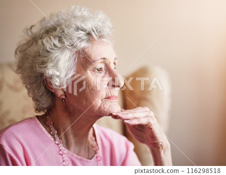 Window, elderly or woman thinking in nursing house with memory, ideas or calm peace on living room. Daydreaming, remember and senior lady with decision and nostalgia in retirement, lounge or home Window, elderly or woman thinking in nursing house with memory, ideas or calm peace on living room. Daydreaming, remember and senior lady with decision and nostalgia in retirement, lounge or home 116298518