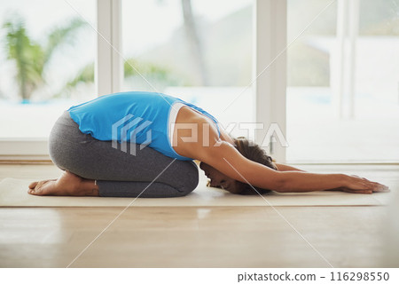 Pilates, stretch workout and woman in home for health, wellness and floor exercise. Yoga, zen chakra and calm yogi for strong spiritual training, holistic workout or peace in apartment living room Pilates, stretch workout and woman in home for health, wellness and floor exercise. Yoga, zen chakra and calm yogi for strong spiritual training, holistic workout or peace in apartment living room 116298550