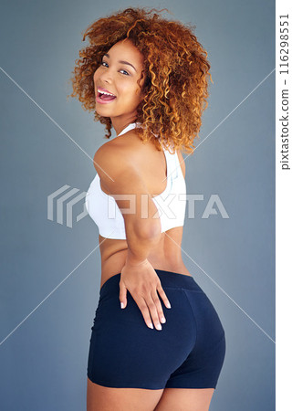 Woman, studio and fitness for slim in portrait, sportswear and confident on gray background. Person, wellness and athlete for results of workout or exercise, happy and proud of body transformation Woman, studio and fitness for slim in portrait, sportswear and confident on gray background. Person, wellness and athlete for results of workout or exercise, happy and proud of body transformation 116298551