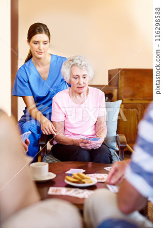 Nursing home, nurse and senior patient with playing cards for games, fun and serious women. People, caregiver and concentrate with bonding for care, support and trust in healthcare for entertainment 116298588