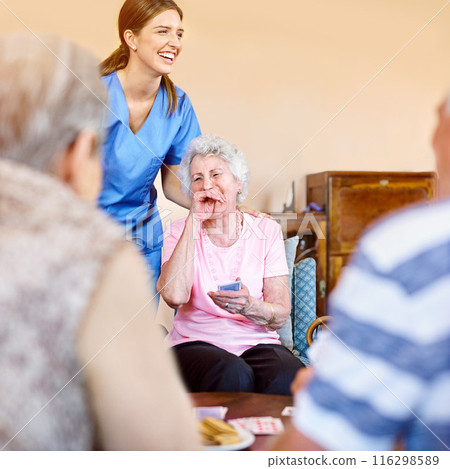 Women, nurse and laughing patient with playing cards for games, fun and happy at nursing home. People, caregiver and smile with bonding for care, support and trust in healthcare for entertainment 116298589