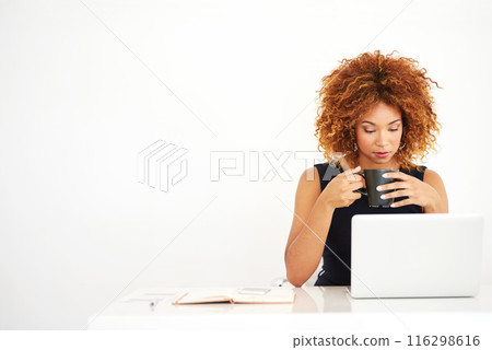 Woman, laptop and coffee in studio by space for mock up with thinking by white background. African person, computer and drink in tea cup with reading, research and notebook for job at creative agency Woman, laptop and coffee in studio by space for mock up with thinking by white background. African person, computer and drink in tea cup with reading, research and notebook for job at creative agency 116298616