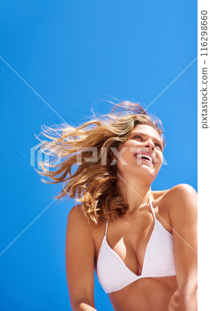 Woman, beach and swimsuit on blue sky for holiday, vacation and summer smile or outdoor wind. Tourist, nature and Miami for confidence, clean air and weekend travel with bikini for low angle mock up Woman, beach and swimsuit on blue sky for holiday, vacation and summer smile or outdoor wind. Tourist, nature and Miami for confidence, clean air and weekend travel with bikini for low angle mock up 116298660