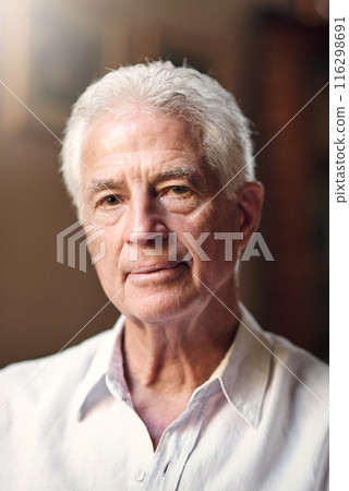 Portrait, confidence or senior man in home to relax with wellness or pride in living room or apartment. Break, face or elderly male person resting with peace or comfort in retirement, lounge or house Portrait, confidence or senior man in home to relax with wellness or pride in living room or apartment. Break, face or elderly male person resting with peace or comfort in retirement, lounge or house 116298691