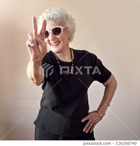 Fashion, sunglasses and senior grandma with peace sign on wall background for stylish, cool and unique fun aesthetic. Retirement, creative beauty and elderly female model with designer woman glasses 116298740