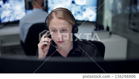 CCTV, headset and security with woman in control room for law enforcement or surveillance. Call, communication and safety with police officer at headquarters for crime, inspection or privacy 116298806