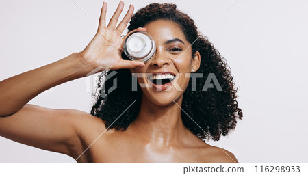 Black woman, skincare and portrait with cream, cosmetics and sunscreen product with smile from beauty. White background, facial and skin glow with eco friendly and anti aging face lotion in studio 116298933