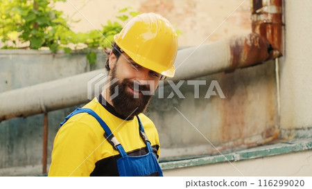 Licensed expert using pressure measurement device for checking air conditioner freon in need of maintenance. Skilled technician working with manometers to look at refrigerant levels Licensed expert using pressure measurement device for checking air conditioner freon in need of maintenance. Skilled technician working with manometers to look at refrigerant levels 116299020