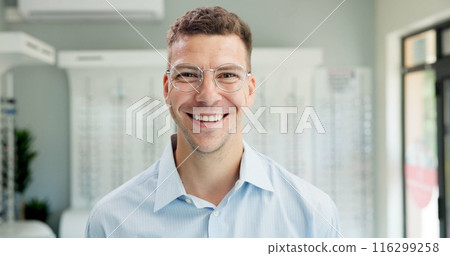 Man, portrait and optometry office with glasses, shopping and eye care assessment with smile. Happy customer, prescription and new frames at wellness consultation with optician and eyeglasses test Man, portrait and optometry office with glasses, shopping and eye care assessment with smile. Happy customer, prescription and new frames at wellness consultation with optician and eyeglasses test 116299258