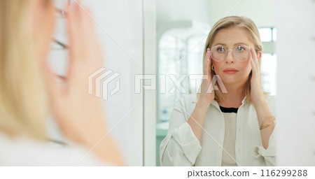 Woman, glasses and mirror at store for vision, eye care and wellness for eyesight, frame and choice. Person, customer and check reflection with decision for optometry, health and style at retail shop 116299288
