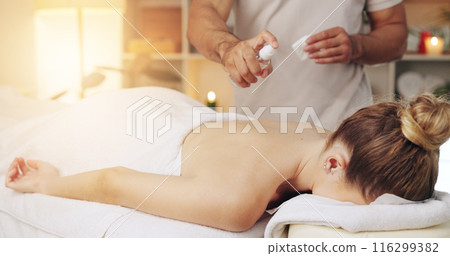 Hand, oil spray and back massage on woman at spa for wellness, relax and stress relief with masseuse. Luxury, therapy and physical therapist with product for body, skin and zen muscle therapy 116299382