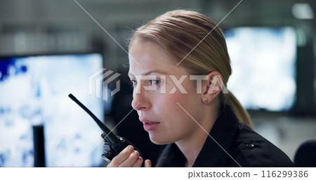 Talking, security and woman with radio, cctv and monitor to watch, danger and control room for guard. Desk, night and working for protection, safety and communication to backup and connection Talking, security and woman with radio, cctv and monitor to watch, danger and control room for guard. Desk, night and working for protection, safety and communication to backup and connection 116299386