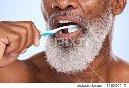 Brushing teeth, mouth and man for dental healthcare, studio and oral hygiene on blue background. Whitening, clean or routine with tooth brush for person, closeup or toothpaste for fresh breath Brushing teeth, mouth and man for dental healthcare, studio and oral hygiene on blue background. Whitening, clean or routine with tooth brush for person, closeup or toothpaste for fresh breath 116299645