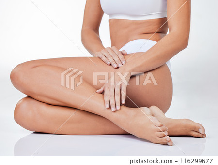 Woman, underwear and legs smooth for cosmetics, skincare and epilation in white studio background. Female person, wax or clean shave touching for health, wellness and hygiene or hair removal 116299677