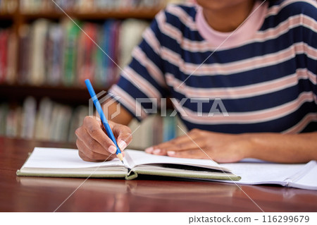 University, studying and hands of woman with books in library for research, college project and learning. Education, academy and student writing with textbooks for knowledge, information and exam 116299679
