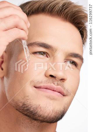 Man, skincare and cosmetic serum for vitamin c, anti aging and hydration for dermatology or wellness. Male person, beauty and results for face, cosmetology for self care in studio as morning routine 116299737