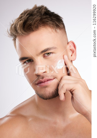 Portrait, man and skincare cream for face for beauty, facial glow and skin health for natural shine in studio. Male person, dermatology and sunscreen with anti aging benefits by white background 116299920