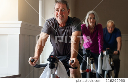 Exercise, spinning class and mature people in gym for cycling, fitness and training with physical activity. Workout club, men and woman on bicycle for health, wellness and endurance with cardio 116299960