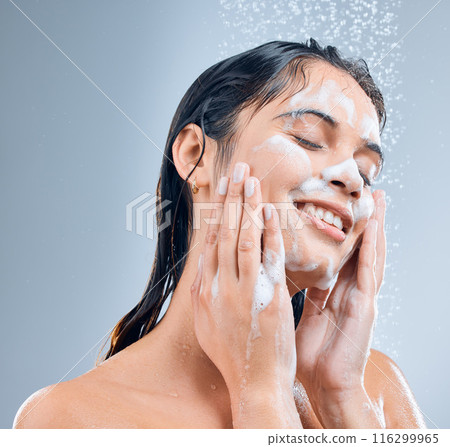 Woman, smile and face for hygiene shower, wash or clean against a blue studio background. Happy, female skincare splash and model person for body wellness, cosmetics soap or healthy skin treatment Woman, smile and face for hygiene shower, wash or clean against a blue studio background. Happy, female skincare splash and model person for body wellness, cosmetics soap or healthy skin treatment 116299965