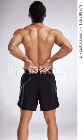 Injury, topless man and holding back pain for spinal stenosis, hurt or training sprain in studio white background. Male person, emergency and body crisis with stress for self care and medical health 116299971