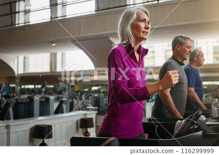 Active, running and senior woman on treadmill in gym for health, wellness and body exercise. Fitness, athlete and elderly people on cardio equipment for endurance workout or training in sports center Active, running and senior woman on treadmill in gym for health, wellness and body exercise. Fitness, athlete and elderly people on cardio equipment for endurance workout or training in sports center 116299999