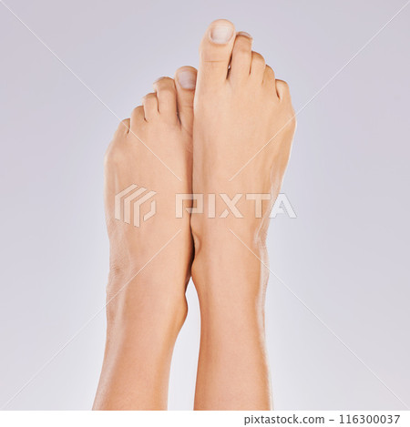 Woman, legs and feet skincare in studio, epilation and grooming cosmetics on white background. Female person, beauty and shaving or waxing for soft skin, hair removal treatment and wellness glow 116300037