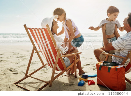 Family, chairs and beach fun with happy people, children and parents together on vacation for bonding. Mother, father and love or relaxing on tropical holiday, wellness break and smile outside Family, chairs and beach fun with happy people, children and parents together on vacation for bonding. Mother, father and love or relaxing on tropical holiday, wellness break and smile outside 116300044