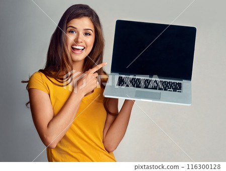 Woman, pointing laptop and portrait for advertising, happy person and isolated in white background. Mock up, smile of girl or screen for product with technology, computer and presentation in studio Woman, pointing laptop and portrait for advertising, happy person and isolated in white background. Mock up, smile of girl or screen for product with technology, computer and presentation in studio 116300128
